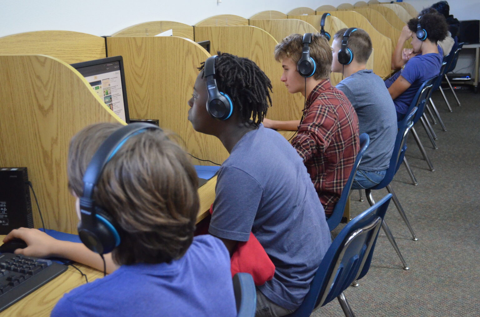 Generation Academy students working at computers in the school lab
